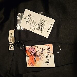 New with tag. About a girl. Size XS. Black cartagena. Long sleeves.